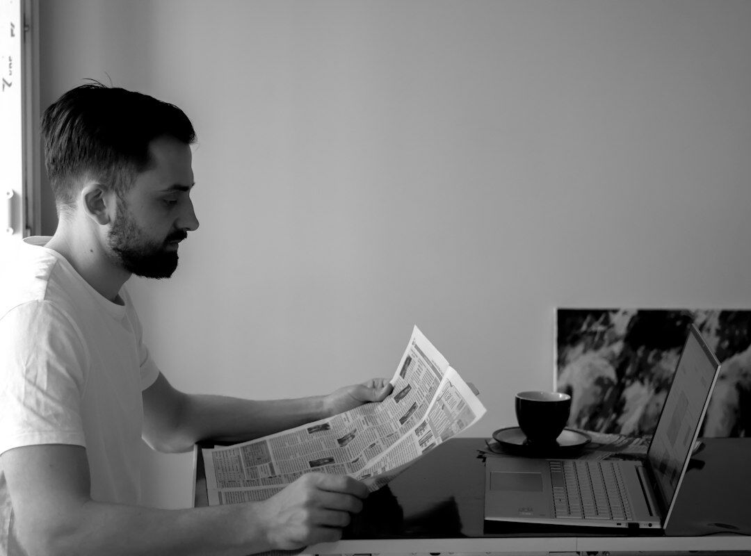 author at desk with real event clippings