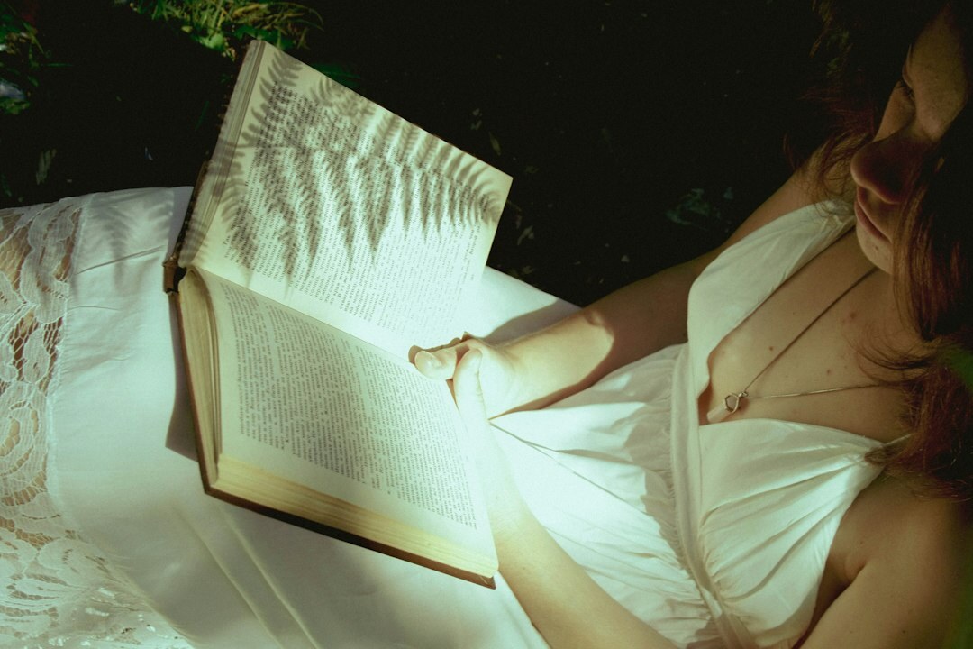person reading mystery novel at night